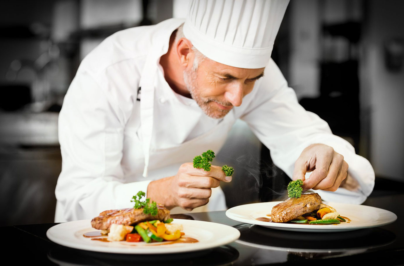 chef apprentice working in restaurant apprenticeship program preparing food.